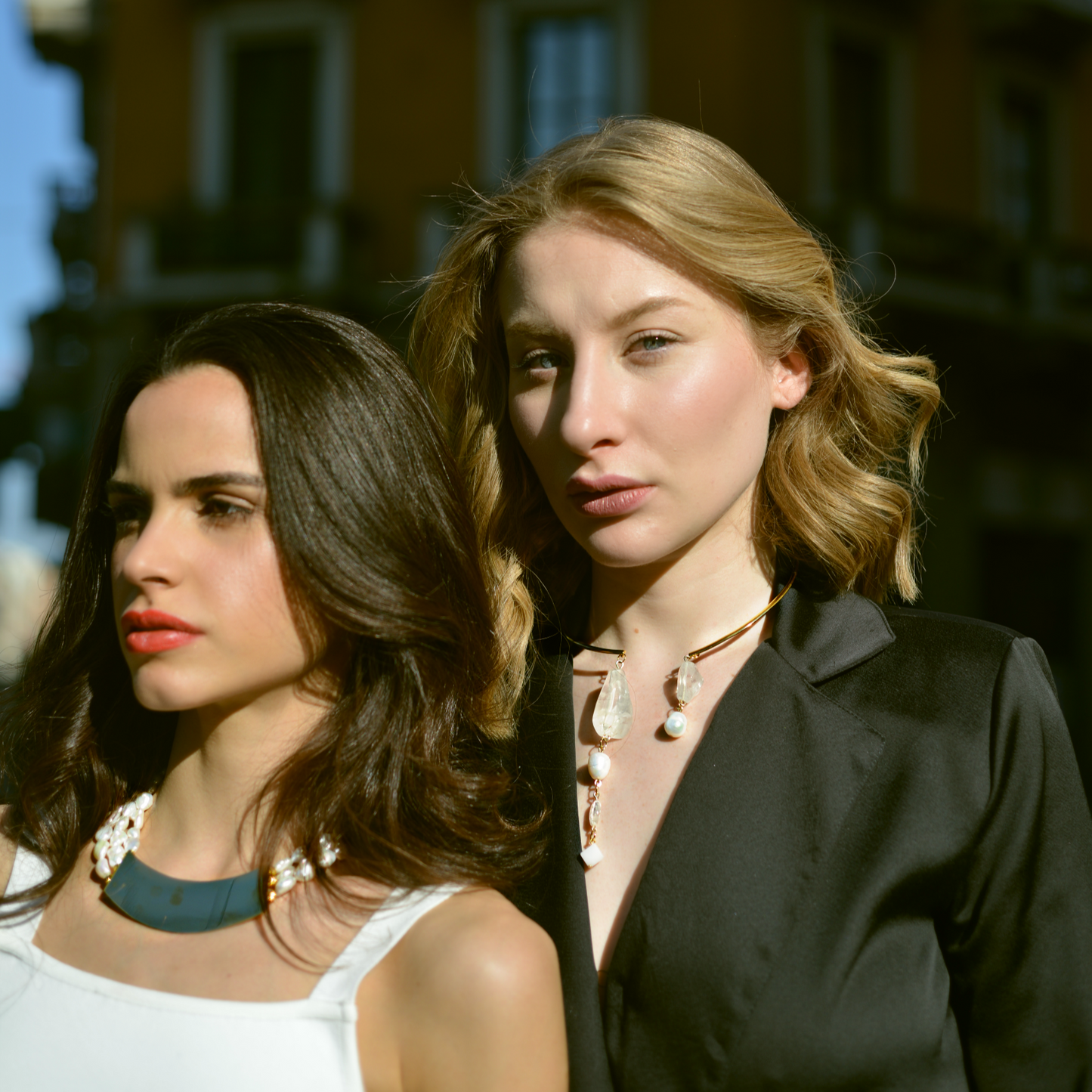 Models wearing necklaces MyOh, in an urban milanese scene.